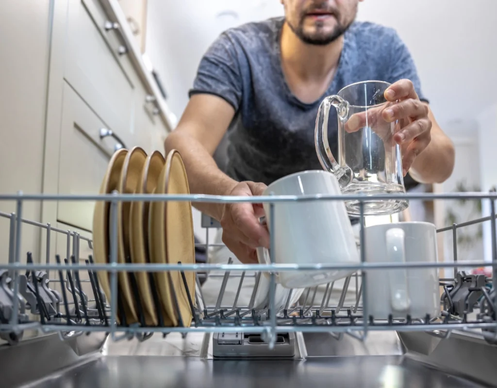 El Cajon plumber performing professional dishwasher installation with secure water line connections.